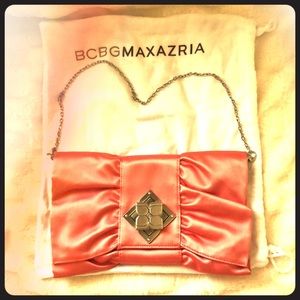 Pink BCBG clutch with optional chain